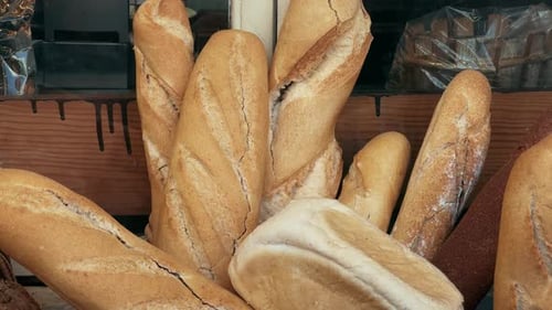 Baguette on the Wooden Bakery Shelf Closeup Shot