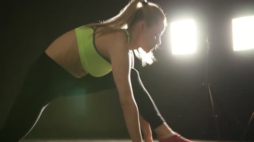 Stretching Young Woman in Studio Fitness Sport Training Gym