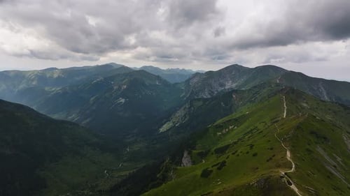 Exploring the breathtaking mountain landscapes under dramatic cloudy skies