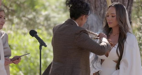 Bride Receives Sage Blessing at Wedding Ceremony
