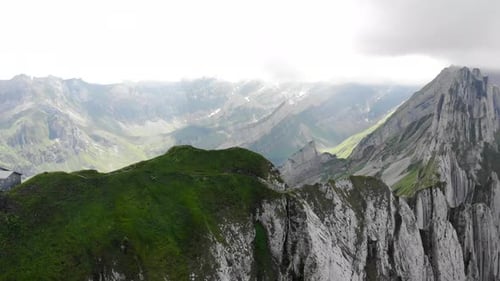 Aerial flyover alongside Schafler ridge in Appenzell, Switzerland with from the Schafler hut toward