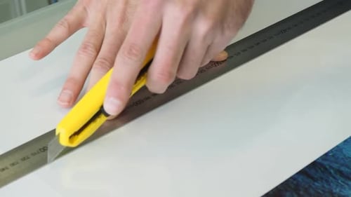 Art creating Acrylic prints of photographs in studio for artist wall art.