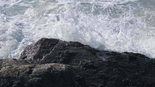 Ocean Waves Crash Against the Rocks on the Coast