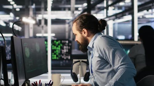 Anxious Technicians in Data Center Reacting to System Lockdown Caused By Hacker