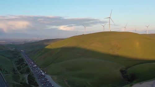 Aerial View of Wind Turbines on nearby hillside