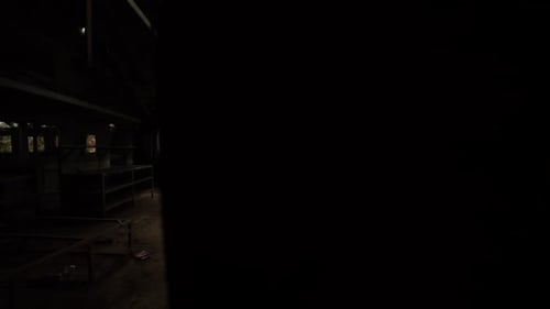 Reveal shot of the interior of a food processing plant at an abandoned insane asylum, mental hospita