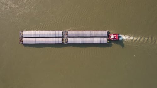 Aerial view of Danube river with cargo ship, Bulgaria.