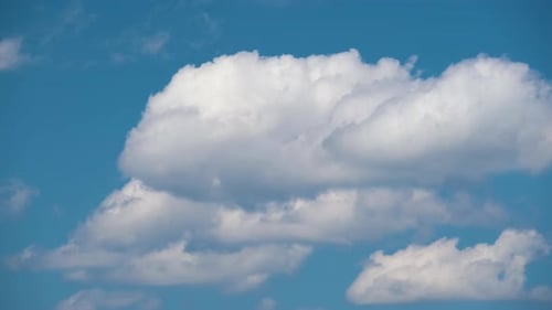 Time Lapse Footage of Fast Moving White Puffy Cumulus Clouds on Blue Clear Sky