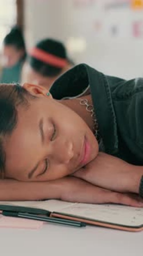 Sleeping, teenager or girl in classroom with fatigue, difficult assessment or burnout from learning