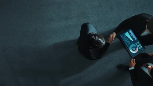 Top view of businessman joined a team and shake hands with manager. Directorate.