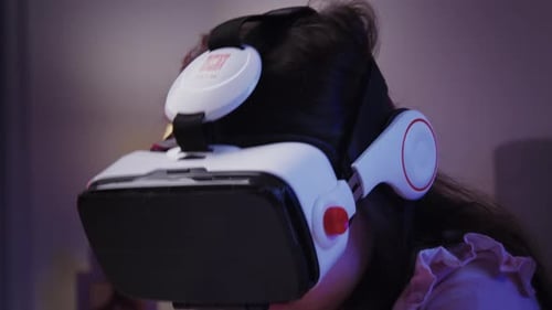 Girl Experiencing Virtual Reality with VR Headset