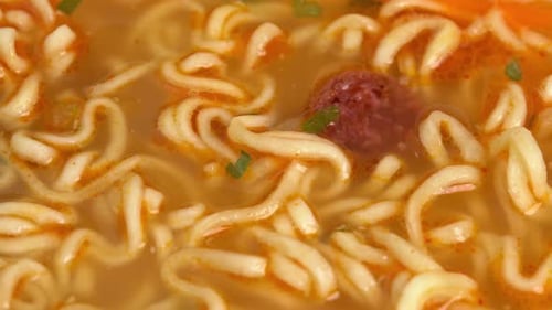 Close Up of Delicious Noodle Soup with Meatball