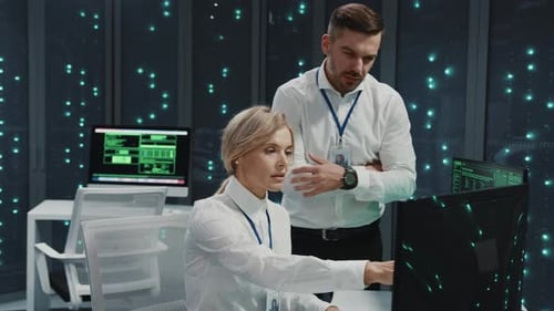 Data Center Caucasian Young Professional Staff of IT Administrators Operating Backup Server Data and