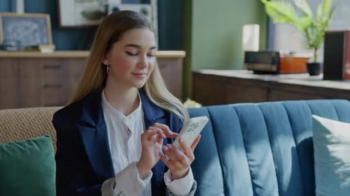 Happy Caucasian Businesswoman Engaging with Smartphone Utilizing Mobile Technology