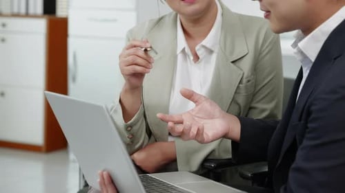 businesspeople working and brainstorming in office
