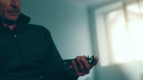 A Disabled Man Assembles a Stroller