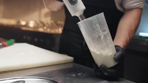 Chef Blending Ingredients with Immersion Blender