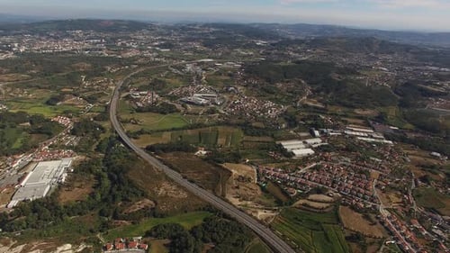 Countryside highway road with traffic heading on both directions Aerial View