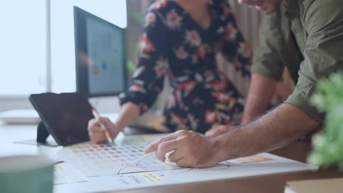 Financial analysts analyze business financial reports on a digital tablet planning investment