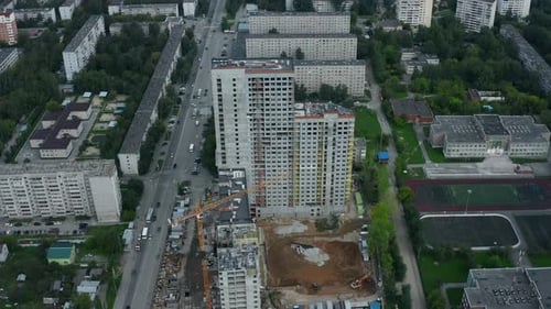 Top view of construction of multi-storey building in city.