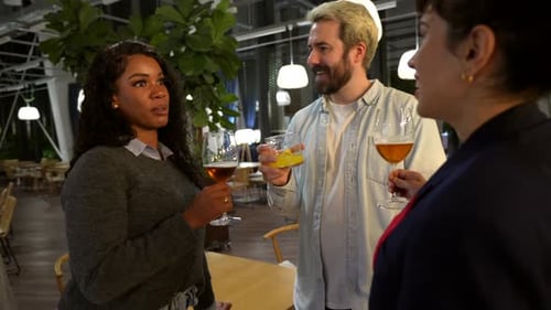 Friends Enjoying Drinks and Conversation Indoors
