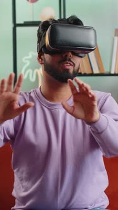 Man Experiencing Virtual Reality Headset in Modern Living Room