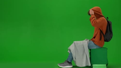 Portrait of Traveler Isolated on Chroma Key Green Screen Background Man Sitting Covered with Plaid