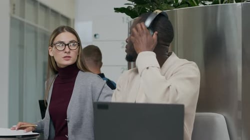 Colleagues Reviewing Documents in Bright Modern Office