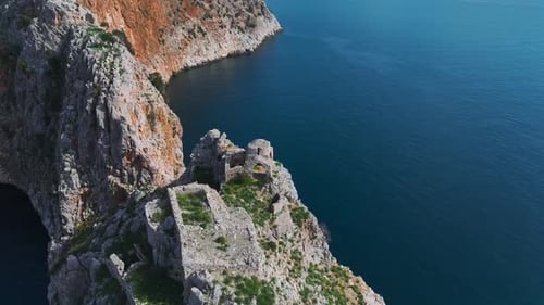 Aerial Video of the Ancient Castle in Alanya Surrounded By Steep Cliffs and the Turquoise
