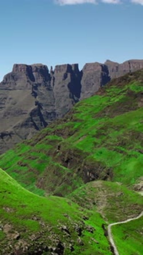 Scenic Winding Mountain Route Vast Landscape Showcasing Curving Mountain Road and Distant Plateau