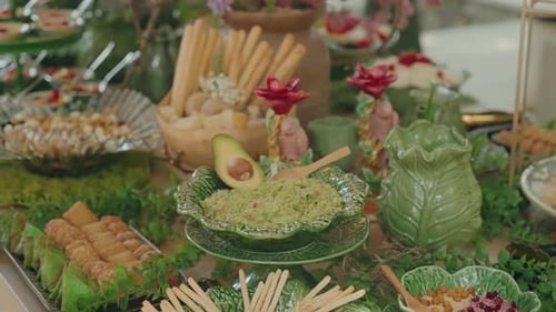 Buffet Table with Assorted Foods and Festive Greenery