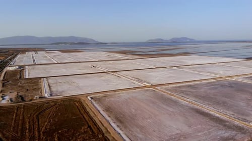 View of a Salt Flat Factory Besides the Sea Drone Shot of Salt Extraction