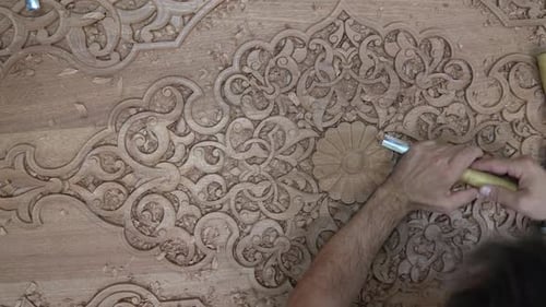 Woodworker Hand Carving Detailed Floral Pattern in Wood