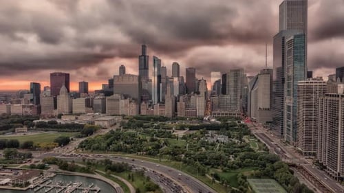 Chicago Millennium Park with city skyline and dramatic clouds hyperlapse at sunset