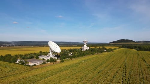 Aerial Panoramic View on the Space Communication Station with Large Size Antenna Orbiting Drone Shot