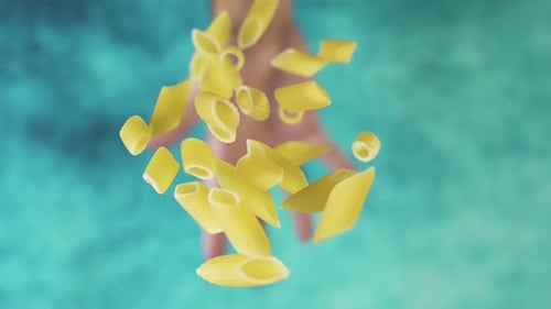 Penne Pasta Tossed Upward from Hand