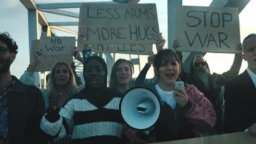 Group of People Protesting for Peace on Bridge