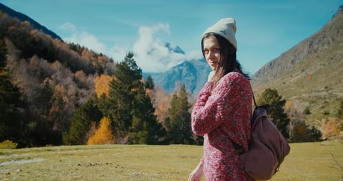 Tourist Walk on Mountain Path at Vacation Trip Watching to Camera and Smile