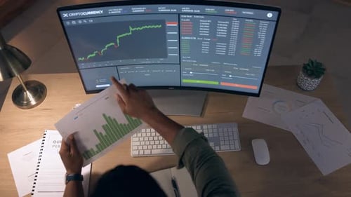 Man at night on computer screen for data analytics, stock market research or digital graphs