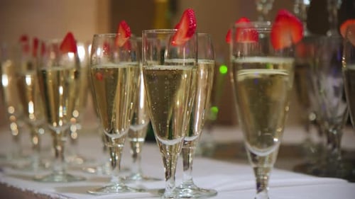 Sparkling Champagne Glasses Adorned with Strawberries for Celebration