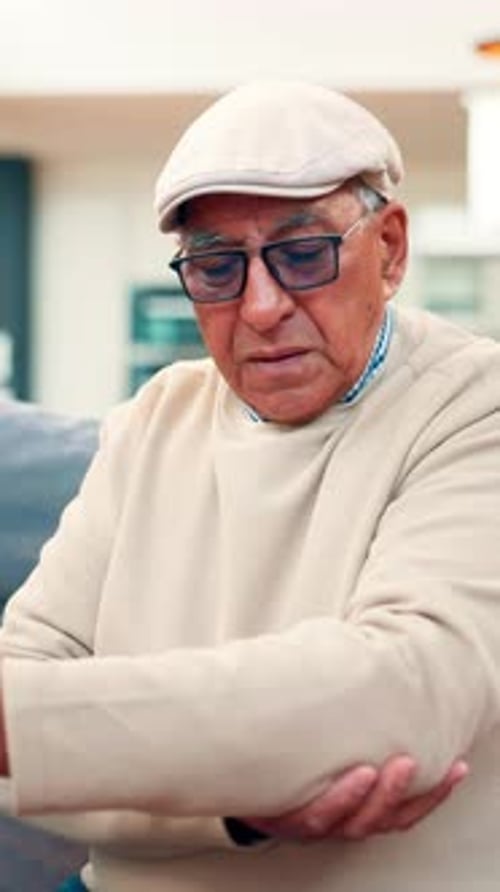 Hurt, old man or stretch in nursing home with elbow pain from arthritis, joint inflammation or ache