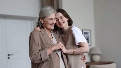 Loving Mother and Daughter Embrace Indoors