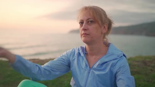 Mature Woman Performing Breathing Pranayama
