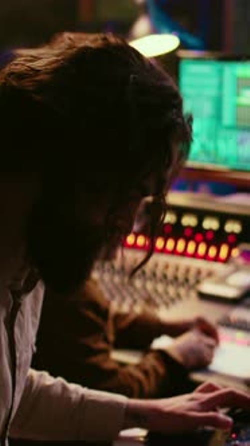 Vertical Video Skilled Musician Performing in Control Room at Studio and Recording Tracks