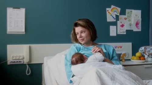 Mother and Newborn in Hospital Room