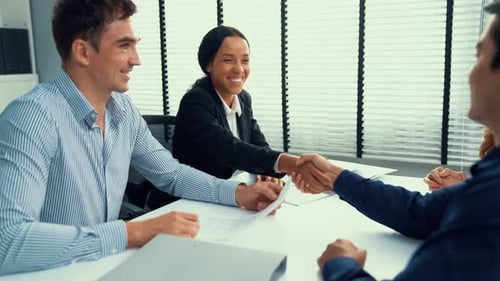 Business Handshake at Corporate Office