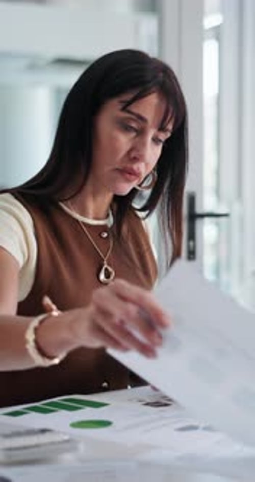 Documents, reading and businesswoman in office for finance review with budget planning for company