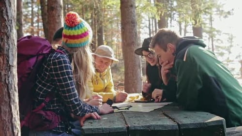 Group of Young Friends Consulting a Map Together