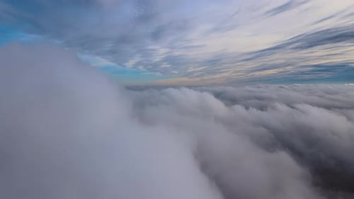 Aerial View From High Altitude of Earth Covered with Puffy Rainy Clouds Forming Before Rainstorm