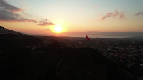 City Skyline with Flag at Sunset Aerial View